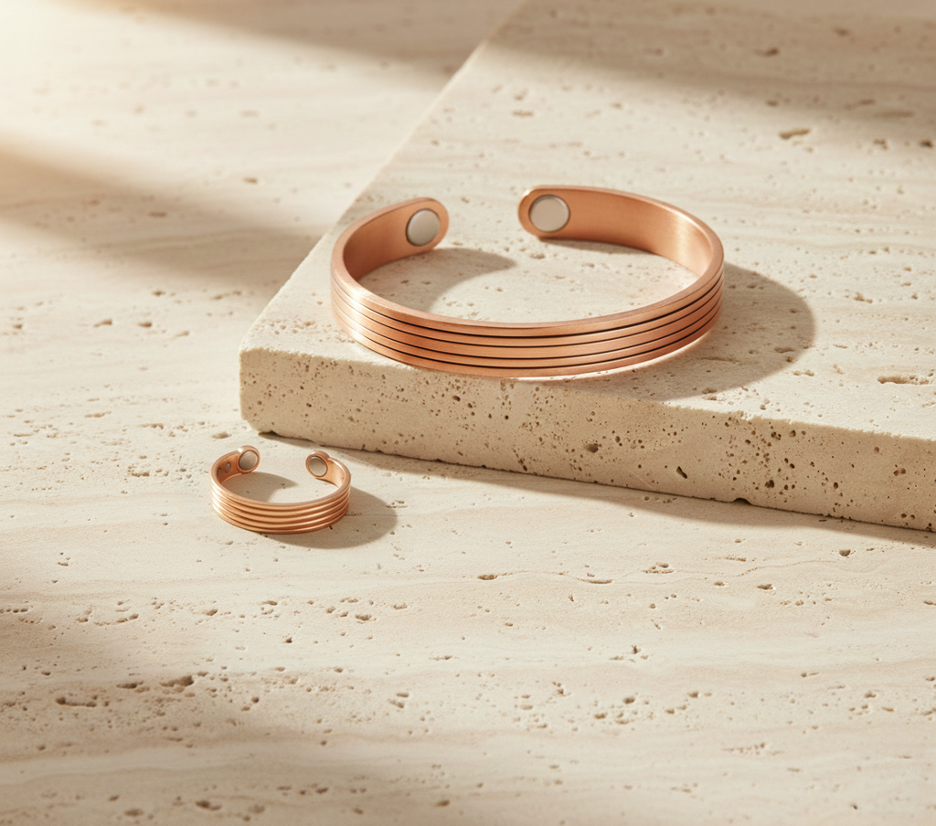 Rose gold bracelet on a textured beige surface